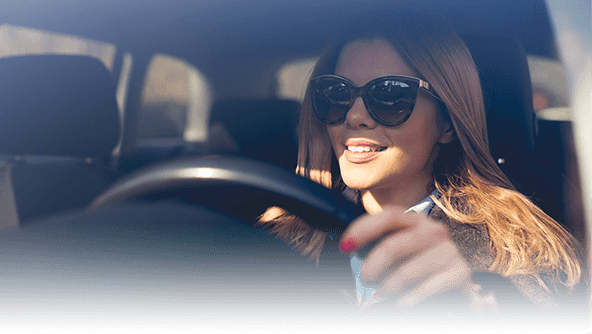 Woman behind the wheel of a car