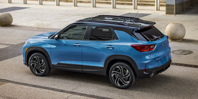 a blue 2026 Chevy Trailblazer SUV is parked outside on a street in Amsterdam, NY