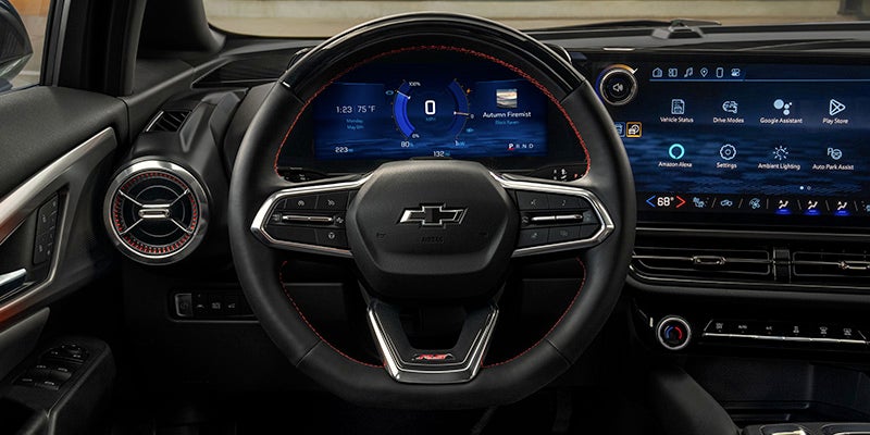 Interior view of the 2025 Chevrolet Equinox EV showing the steering wheel and digital dash display.