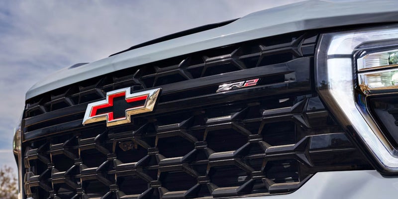 A closeup view of the 2025 Chevy Silverado HD 2500 grill near Mangino Chevrolet.