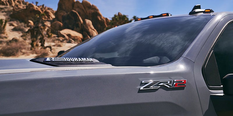 A closeup view of the 2025 Chevy Silverado HD 2500 ZR2 logo, near Mangino Chevrolet.
