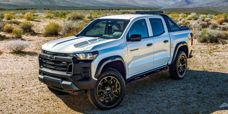 A white 2026 Chevrolet Colorado parked in a desert landscape
